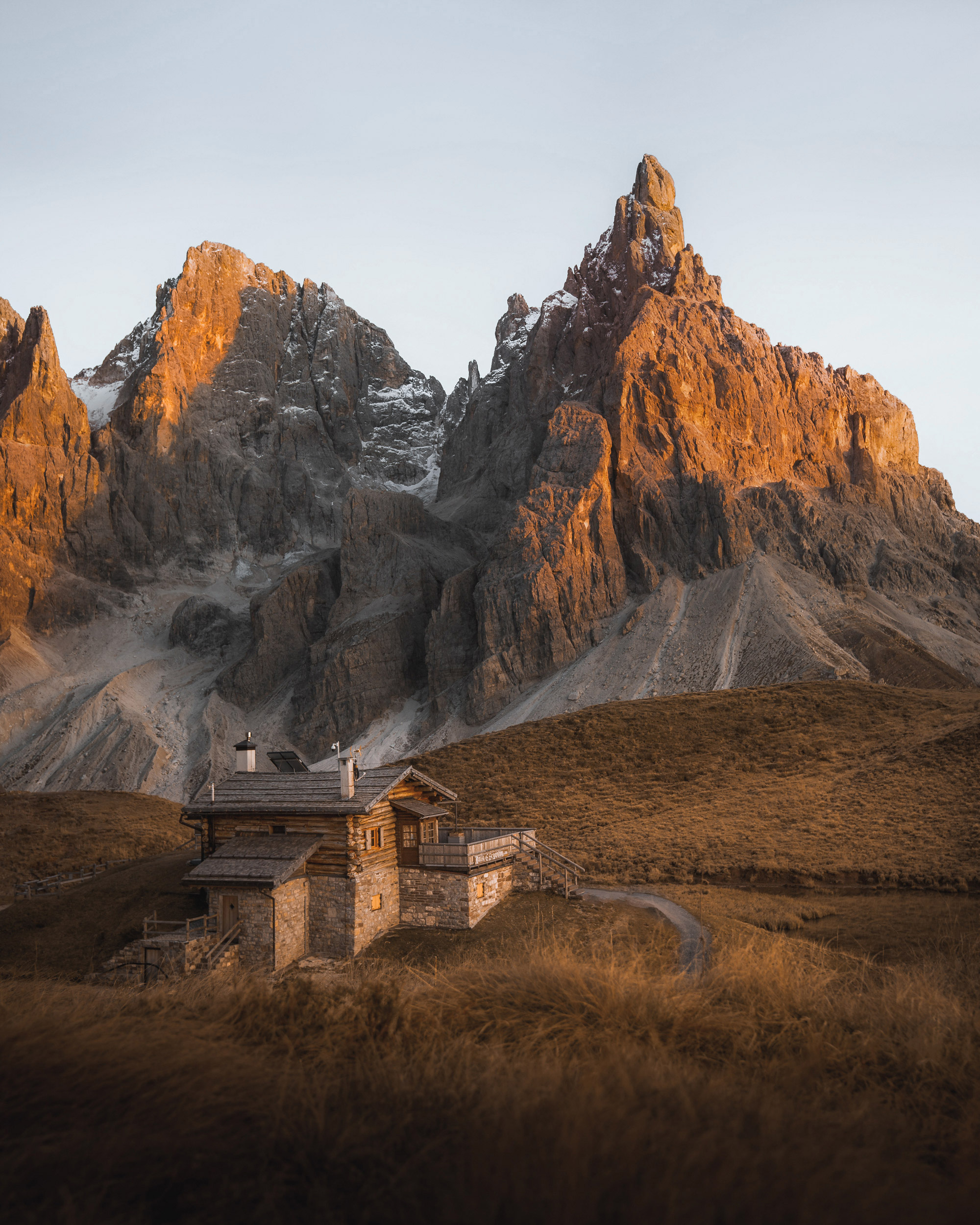 Rustic mountain chalet nestled amongst towering peaks.
